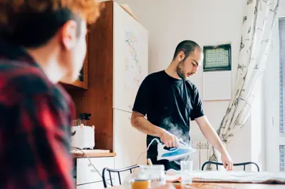 Person using a clothes iron