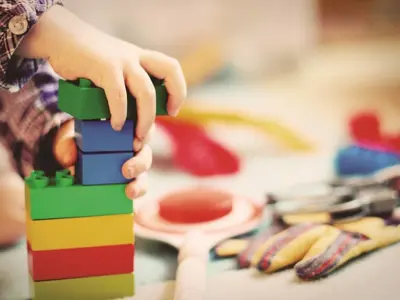 Close up of child playing with blocks