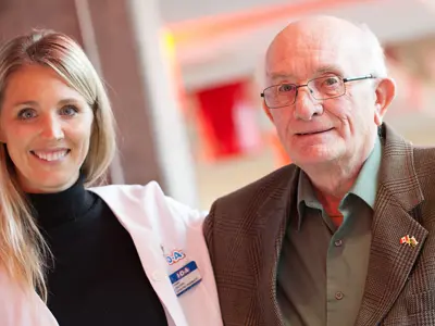 Two people standing next to each other