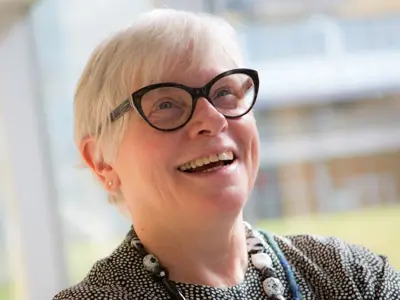 An older adult smiling