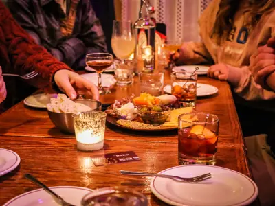 People gathered around a candlelit meal